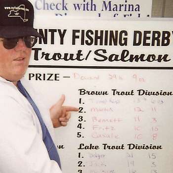 Raymond Martin pointing to his spot on the leader board