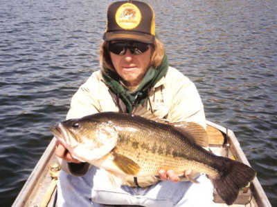 Brett Richardson with a 7 pound 3 ounce Largemouth Bass that he caught from Round Lake