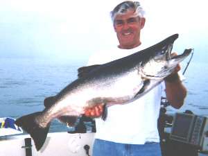 Conrad St. Laurent with a Lake Ontario King Salmon caught aboard Rodmaster Charters out of Irondequoit Bay