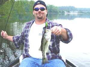 Pictured here is Dan Fleitman who was casting a Jitter Bug to a to old dock, when this beauty attacked his lure. The fish were biting so good that we stoped counting how many were caught and released after 18 bass and 3 nice pickerel