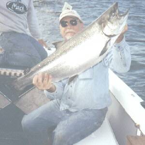 Greg Komenko is pictured here with a nice 25 pound king salmon taken in early August 2004.