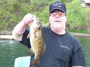 Jack Dillion alias Da' Basser poses for a photo with a beautiful Keuka Lake smallmouth bass