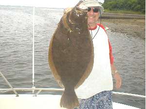 On Friday August 8, 2003  James Tully and friends were fishing near the sea buoy off Shinnecock Inlet. Thats when he hooked and landed this 8 pound 12 ounce, fluke aboard his friends boat, the 