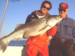Mike the mate on the Windy with a 30 pound striped bass