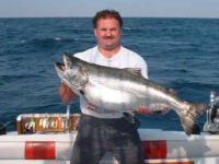 Craig Rice of Canton, Ohio caught this 38 pound King Salmon from Lake Ontario in July 15, 2002