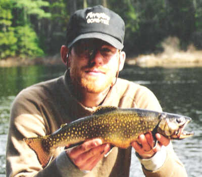 Mike Crawford of Upstate Guide Service with a fantastic Brook Trout caught on a big streamer in early spring from the Central Adirondacks