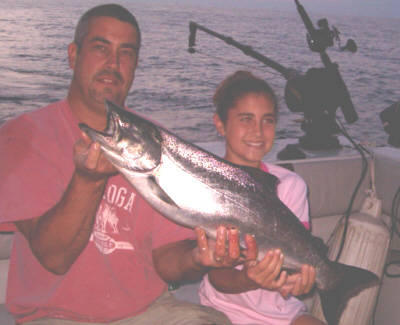 Pictured here is Ed Meisner with his daughter Marissa. She is all smiles after catching her first King Salmon from Lake Ontario